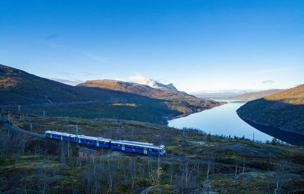 A clear autumn day along the Ofot line with The Arctic Train in front