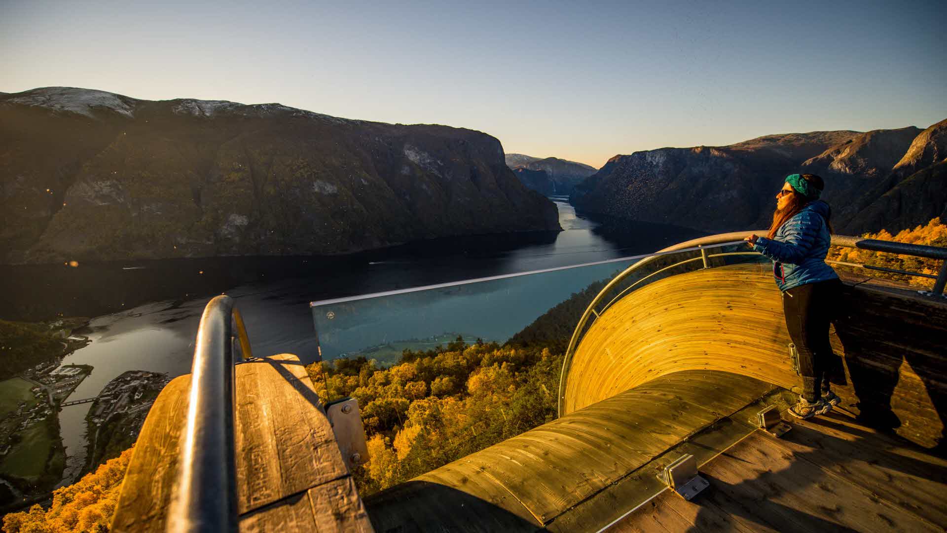 People in summer on top of Stegastein Viewpoint platform overlooking Aurland